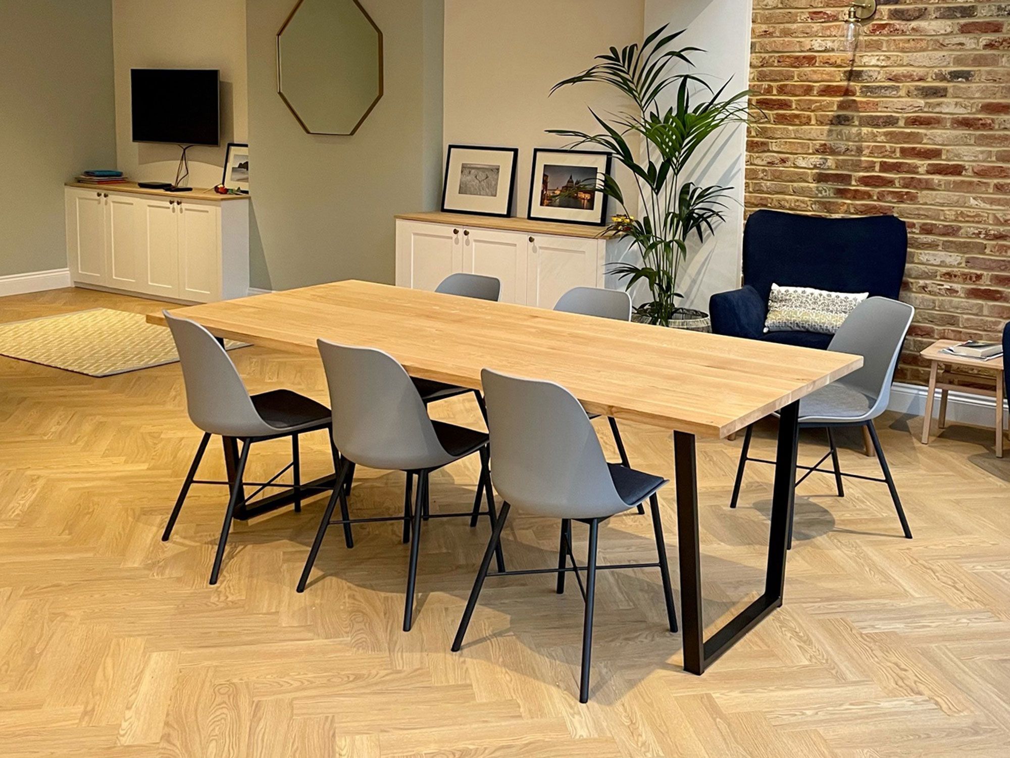 Grain and Frame Natural Oak Dining Table Trapezium Black Steel Leg